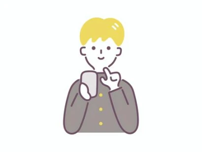 スマホを操作する男子学生