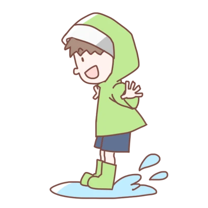 水たまりにジャンプする男の子